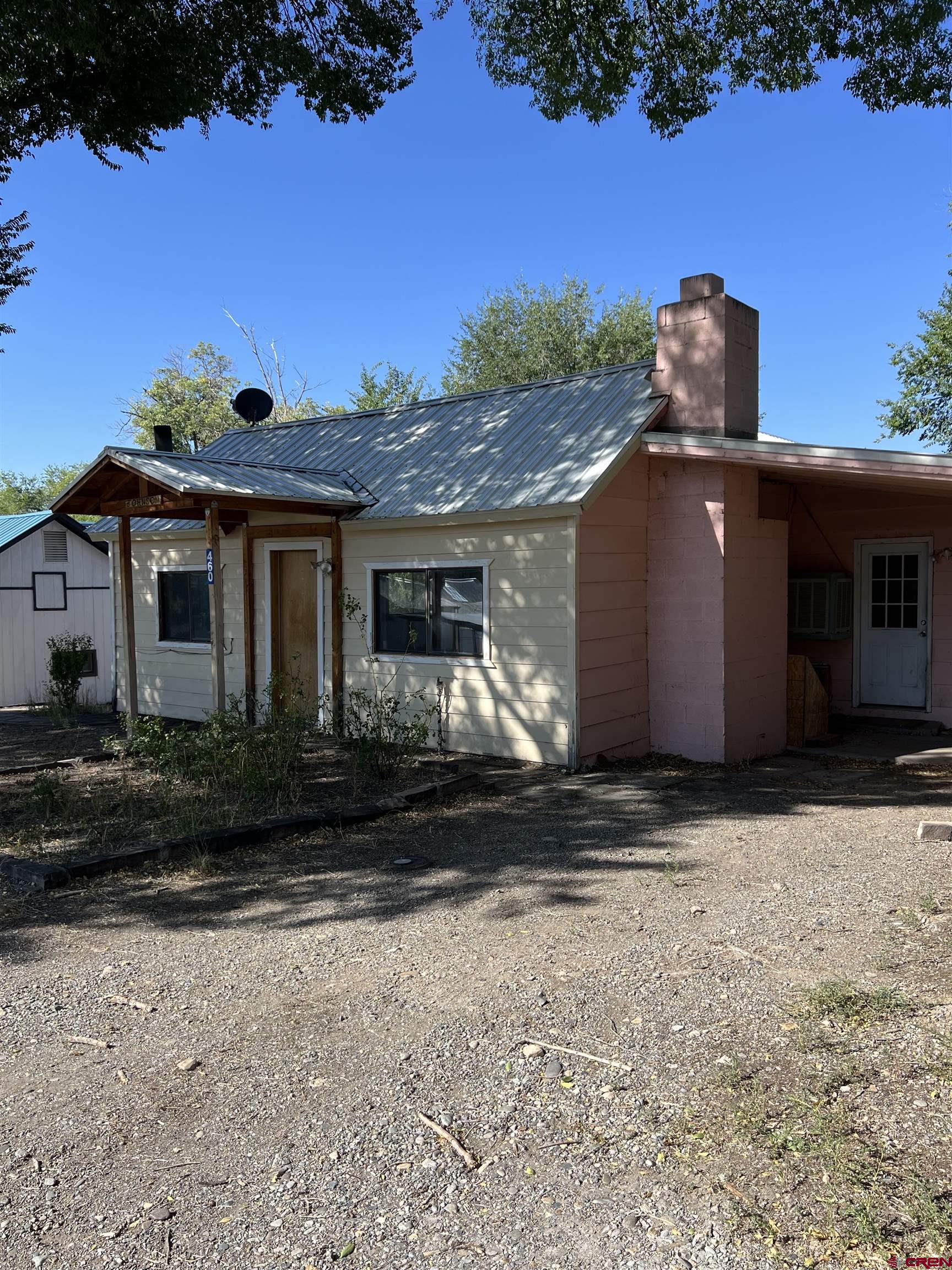 460 Fox Street Nucla, CO 81424 - Photo 2 of 35 a front view of a house with a yard