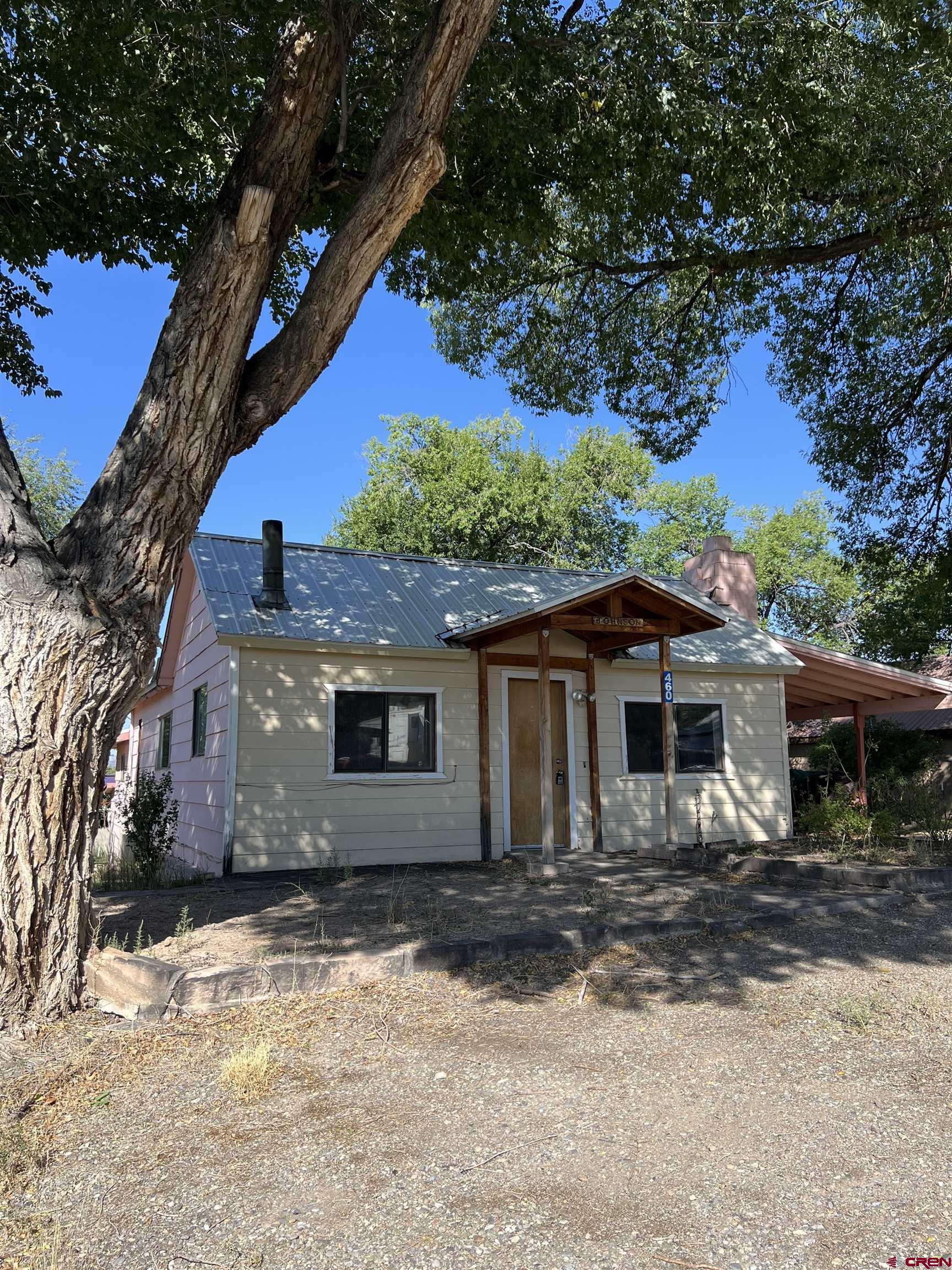 460 Fox Street Nucla, CO 81424 - Photo 3 of 35 a view of a house with a yard