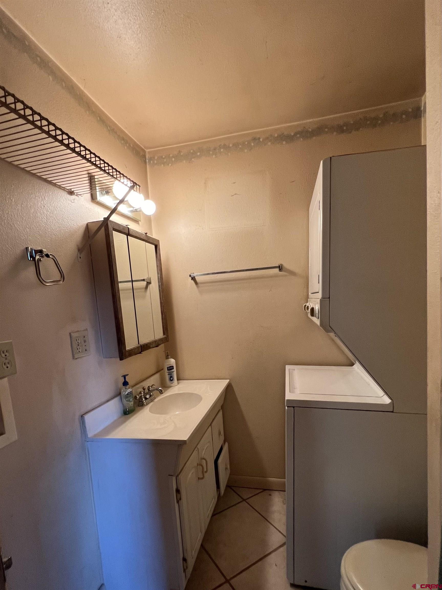 460 Fox Street Nucla, CO 81424 - Photo 33 of 35 a bathroom with a sink mirror vanity and toilet