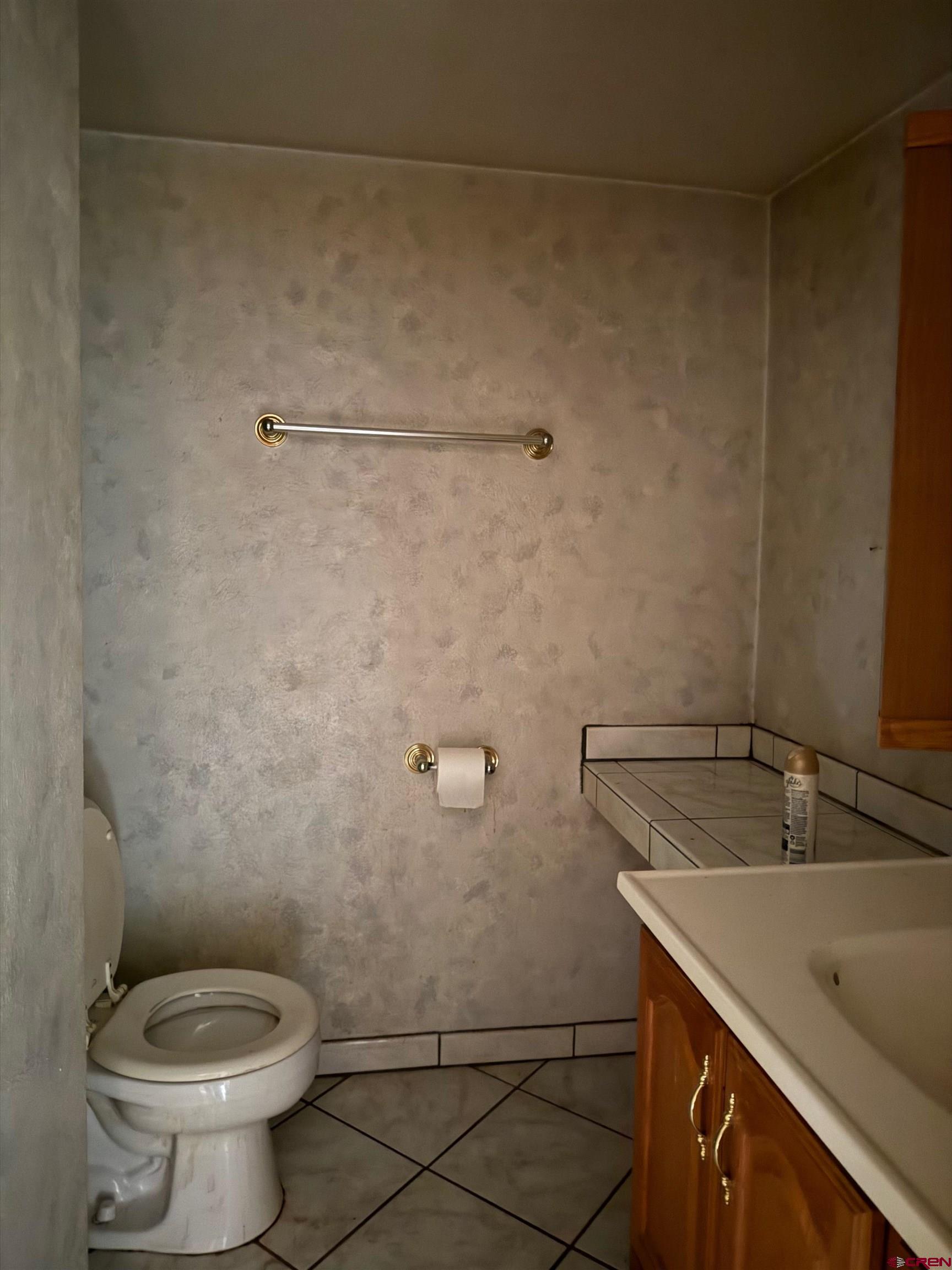 460 Fox Street Nucla, CO 81424 - Photo 34 of 35 a bathroom with a sink a toilet and a mirror