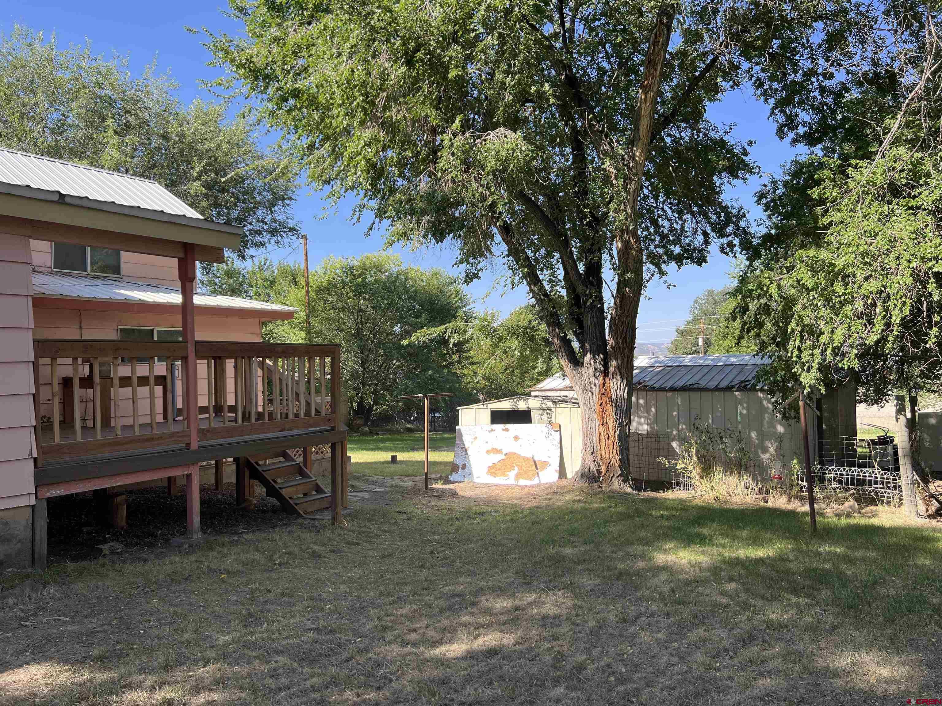 460 Fox Street Nucla, CO 81424 - Photo 7 of 35 a backyard of a house with table and chairs