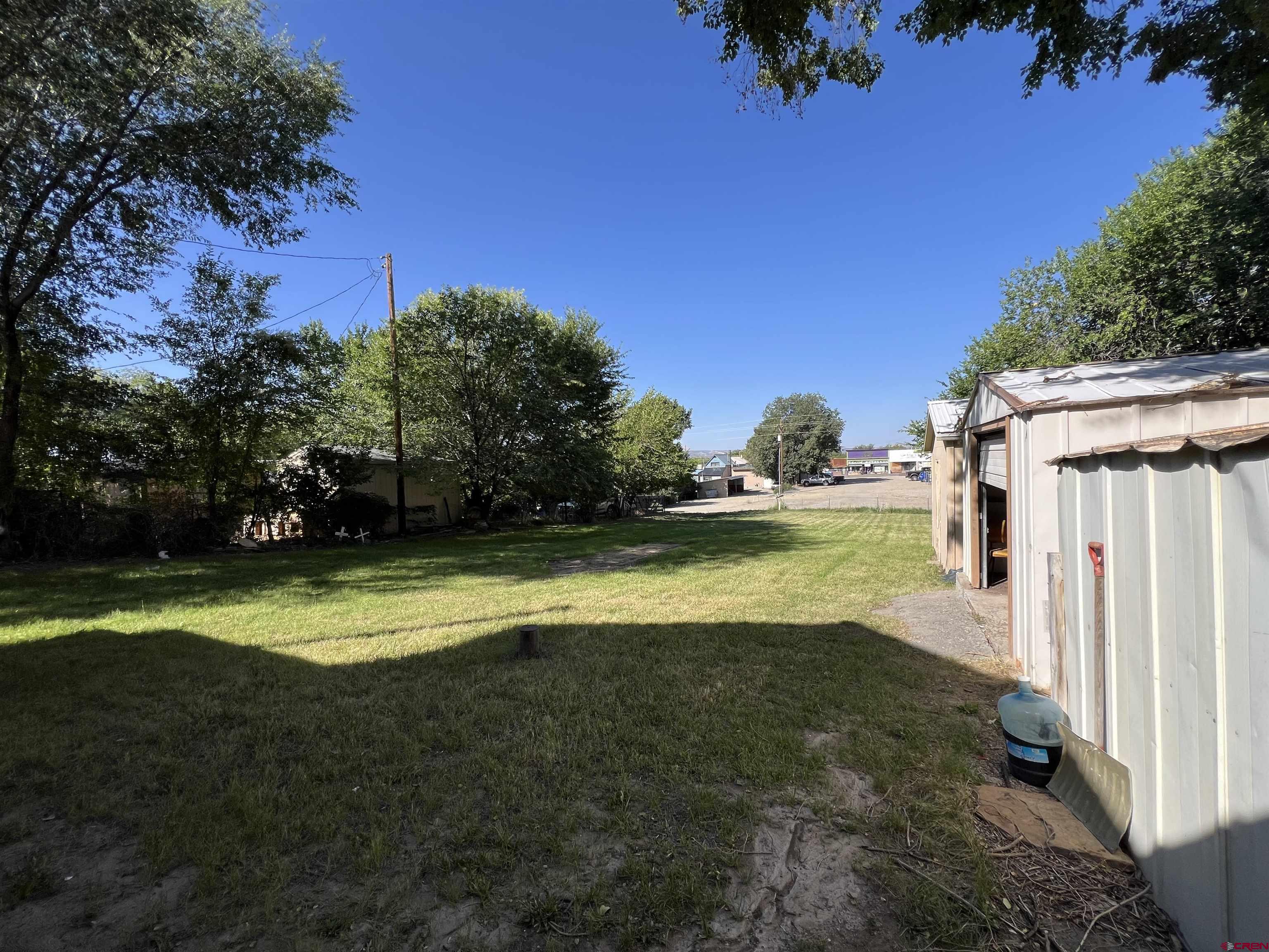 460 Fox Street Nucla, CO 81424 - Photo 9 of 35 a view of a house with a backyard