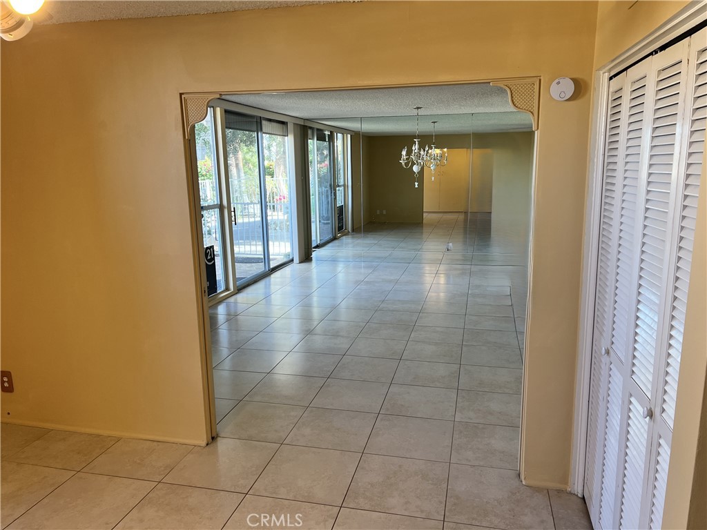 42278 Dunes View Road, Unit 28 Rancho Mirage, CA 92270 - Photo 15 of 57 a view of a hallway with an empty room and a window