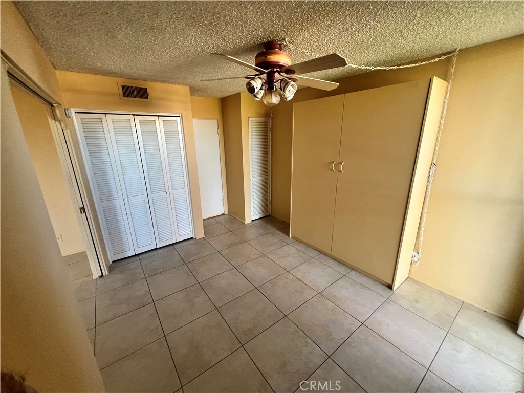 42278 Dunes View Road, Unit 28 Rancho Mirage, CA 92270 - Photo 18 of 57 a view of a room with wooden walls