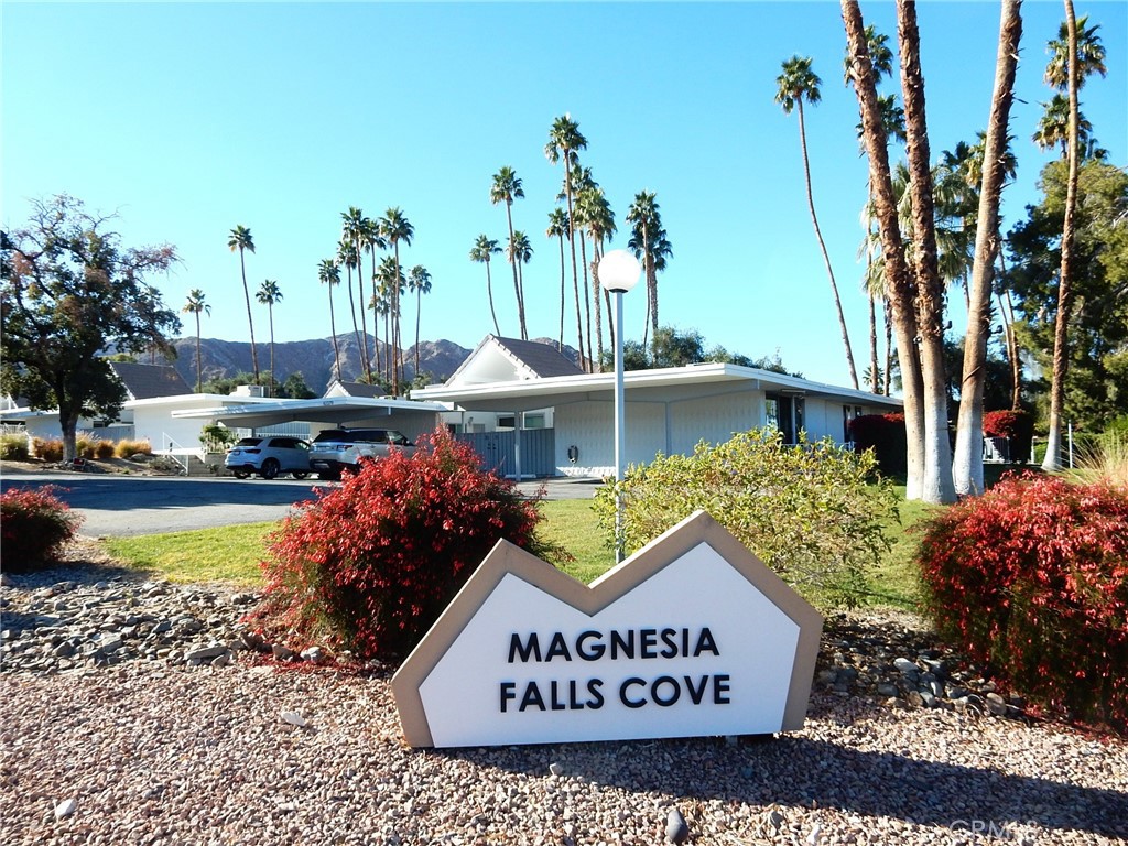 42278 Dunes View Road, Unit 28 Rancho Mirage, CA 92270 - Photo 2 of 57 a view of swimming pool with a garden and plants