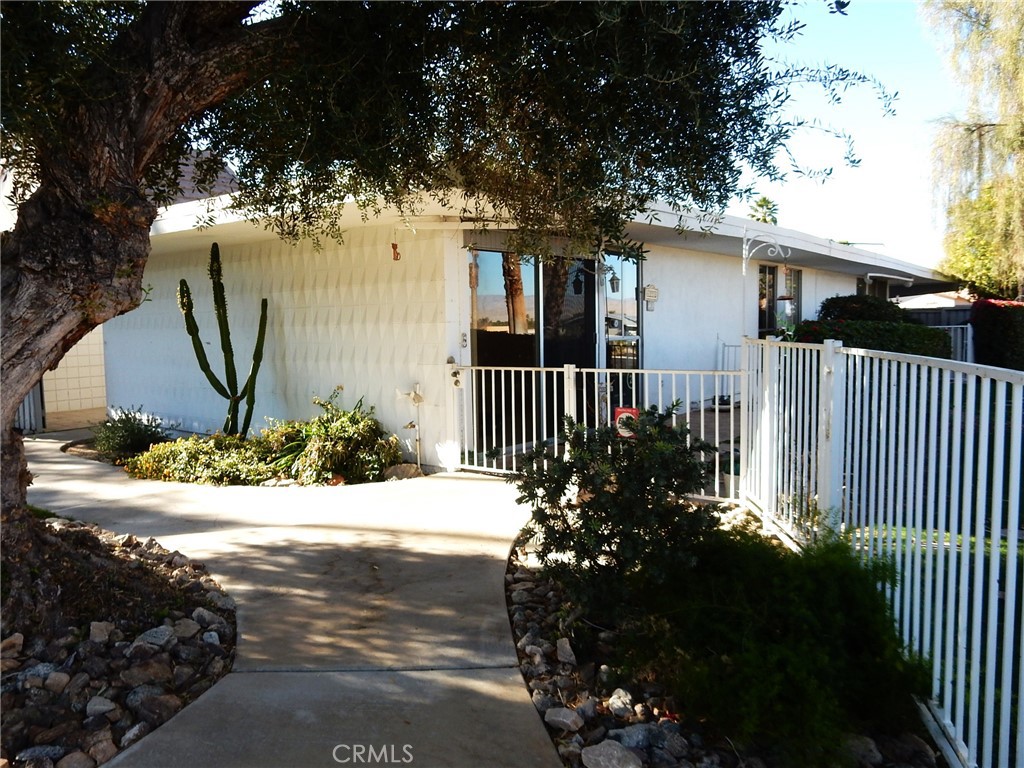 42278 Dunes View Road, Unit 28 Rancho Mirage, CA 92270 - Photo 28 of 57 a view of a house with a yard