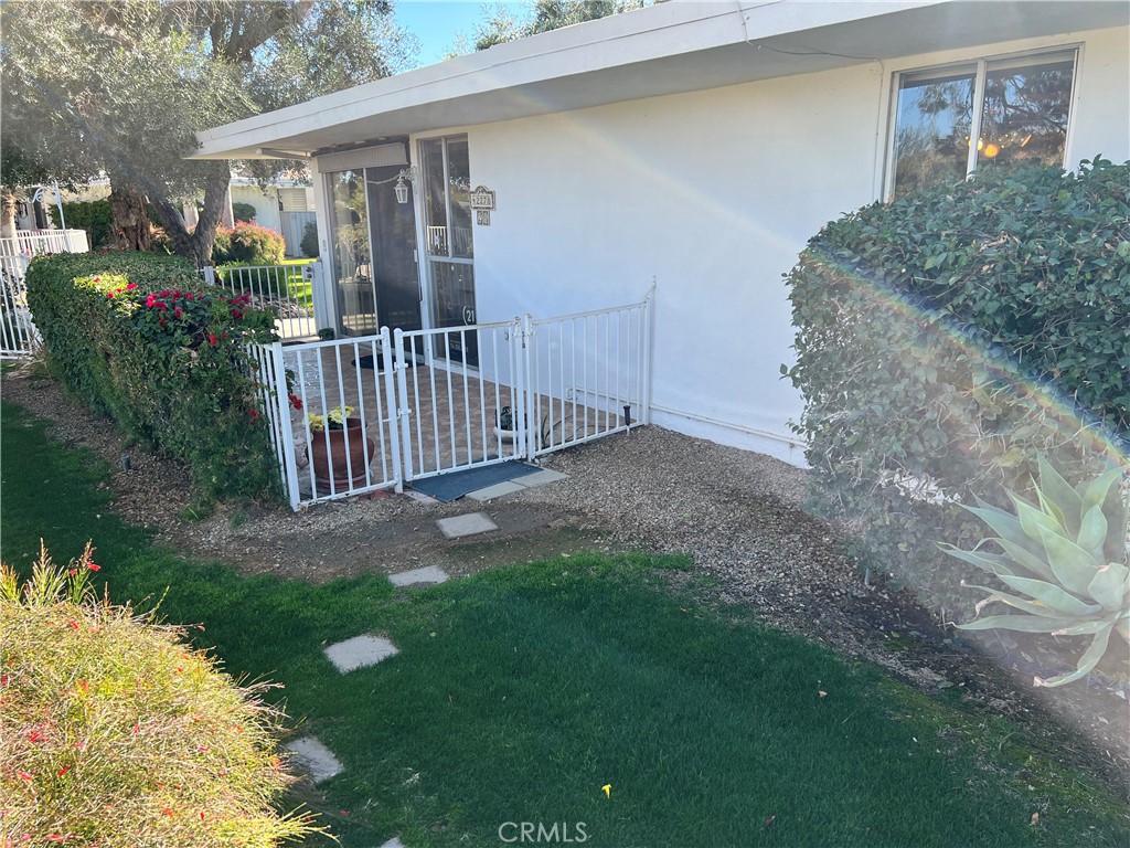 42278 Dunes View Road, Unit 28 Rancho Mirage, CA 92270 - Photo 32 of 57 a view of backyard and porch