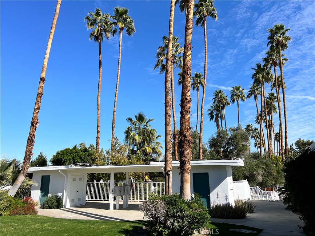 42278 Dunes View Road, Unit 28 Rancho Mirage, CA 92270 - Photo 46 of 57 front view of a house with a yard