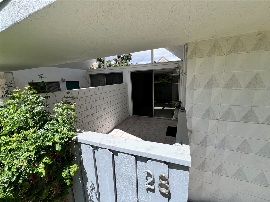 42278 Dunes View Road, Unit 28 Rancho Mirage, CA 92270 - Photo 8 of 57 a view of entryway with a potted plant