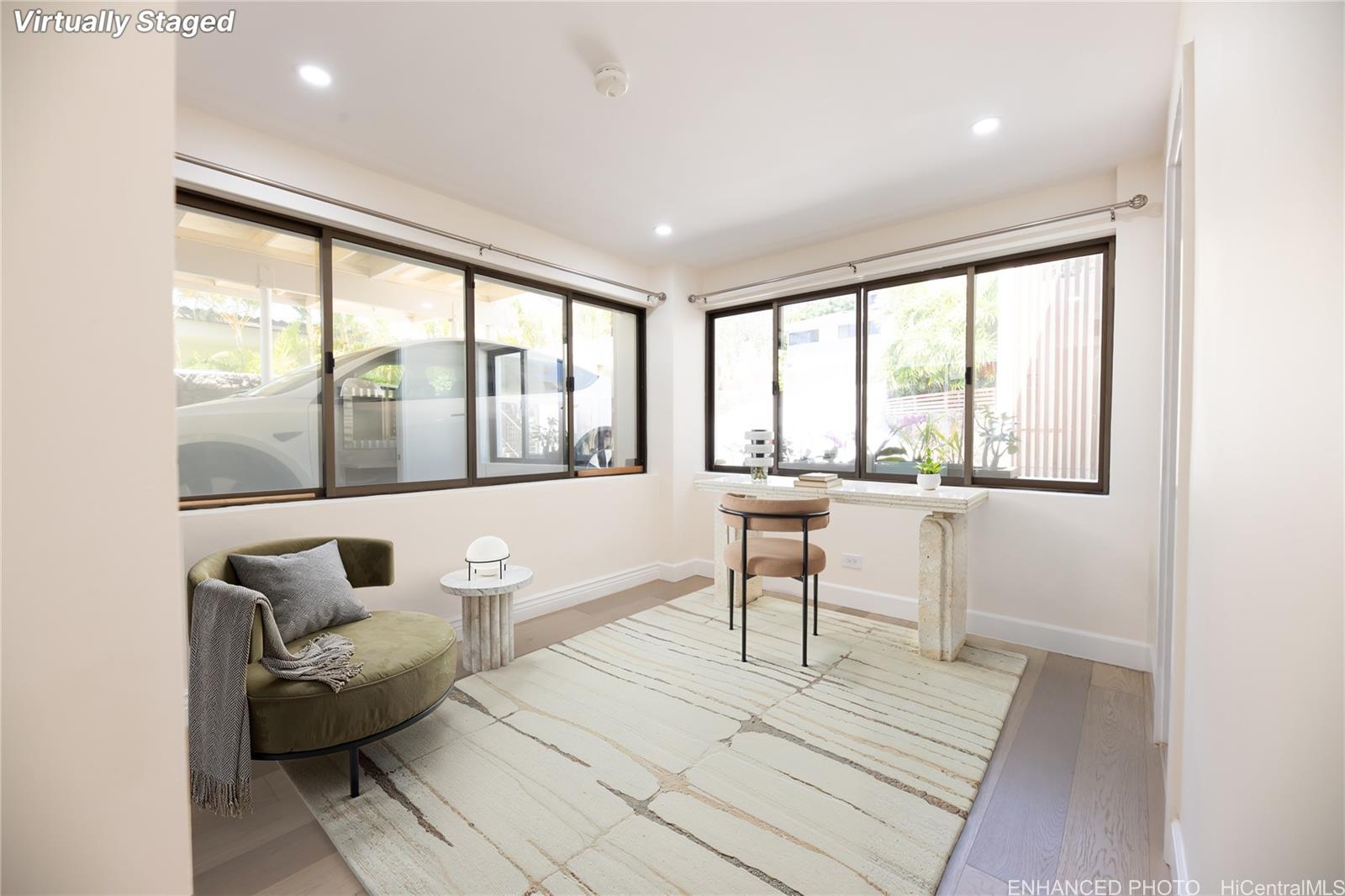 1632 Ihiloa Loop Honolulu, HI 96821 - Photo 22 of 24 a living room with furniture and a large window
