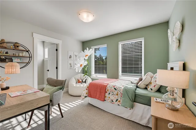 a bedroom with bed and a window