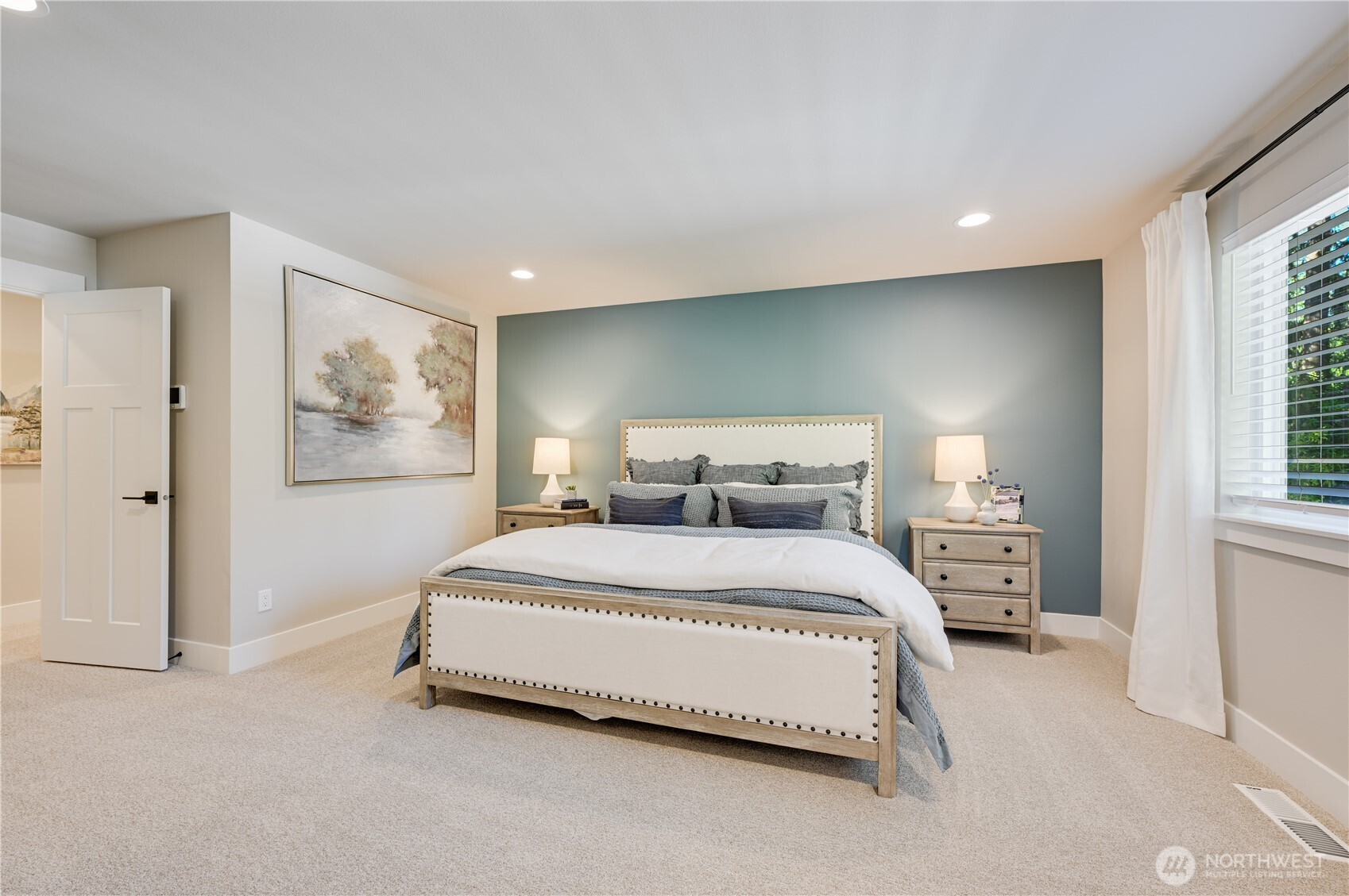 19216 Meridian Drive Southeast, Unit CW 07 Bothell, WA 98012 - Photo 27 of 37 a bedroom with a large bed and a window