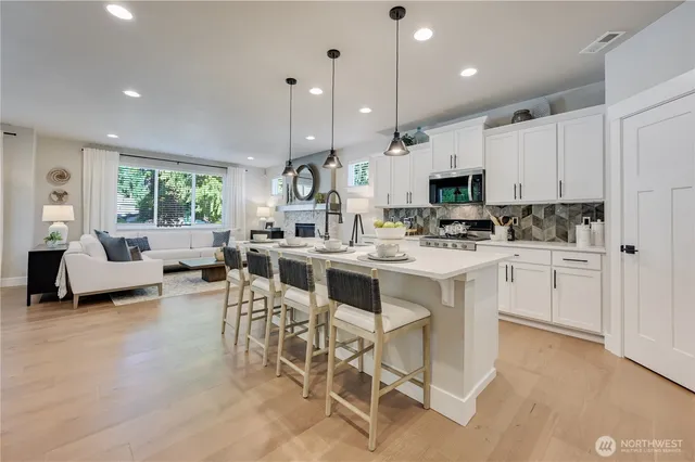 a kitchen with a sink cabinets and window