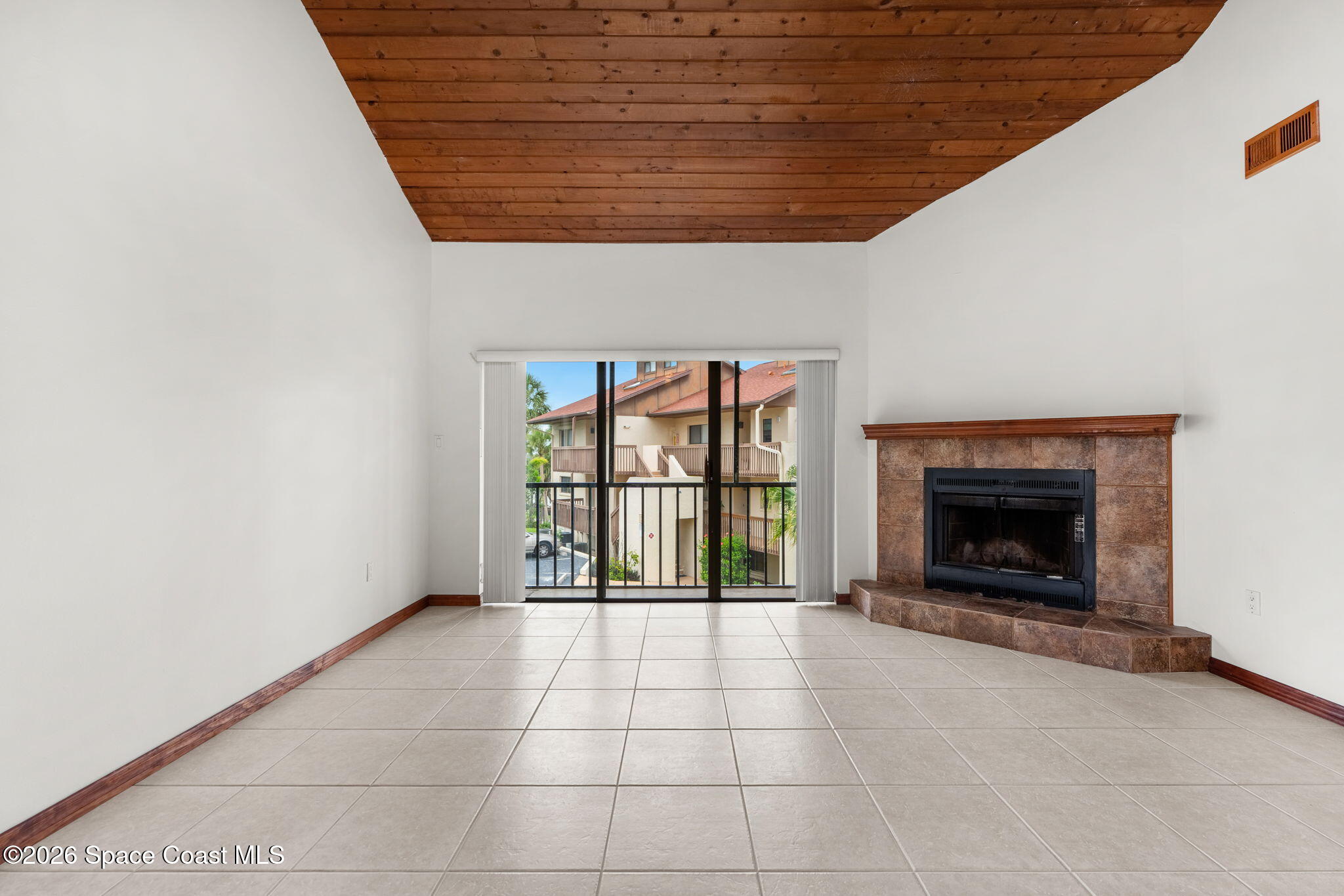 3121 Kirkland Road Northeast Palm Bay, FL 32905 - Photo 19 of 52 a view of an empty room with a fireplace