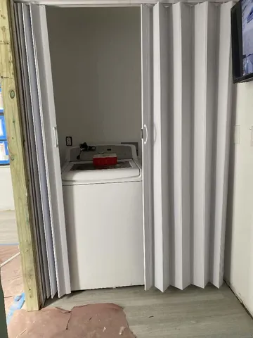 a utility room with dryer and washer