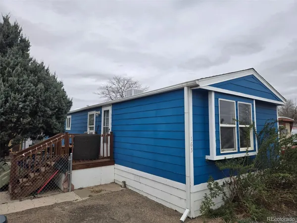 a front view of a house with a garage