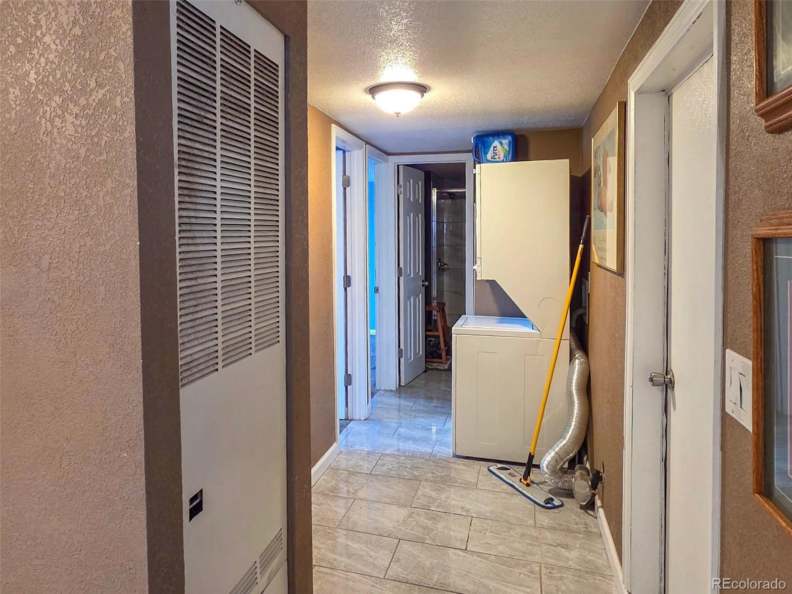 1401 9th Street Fort Lupton, CO 80621 - Photo 8 of 17 a view of a hallway with furniture and entryway