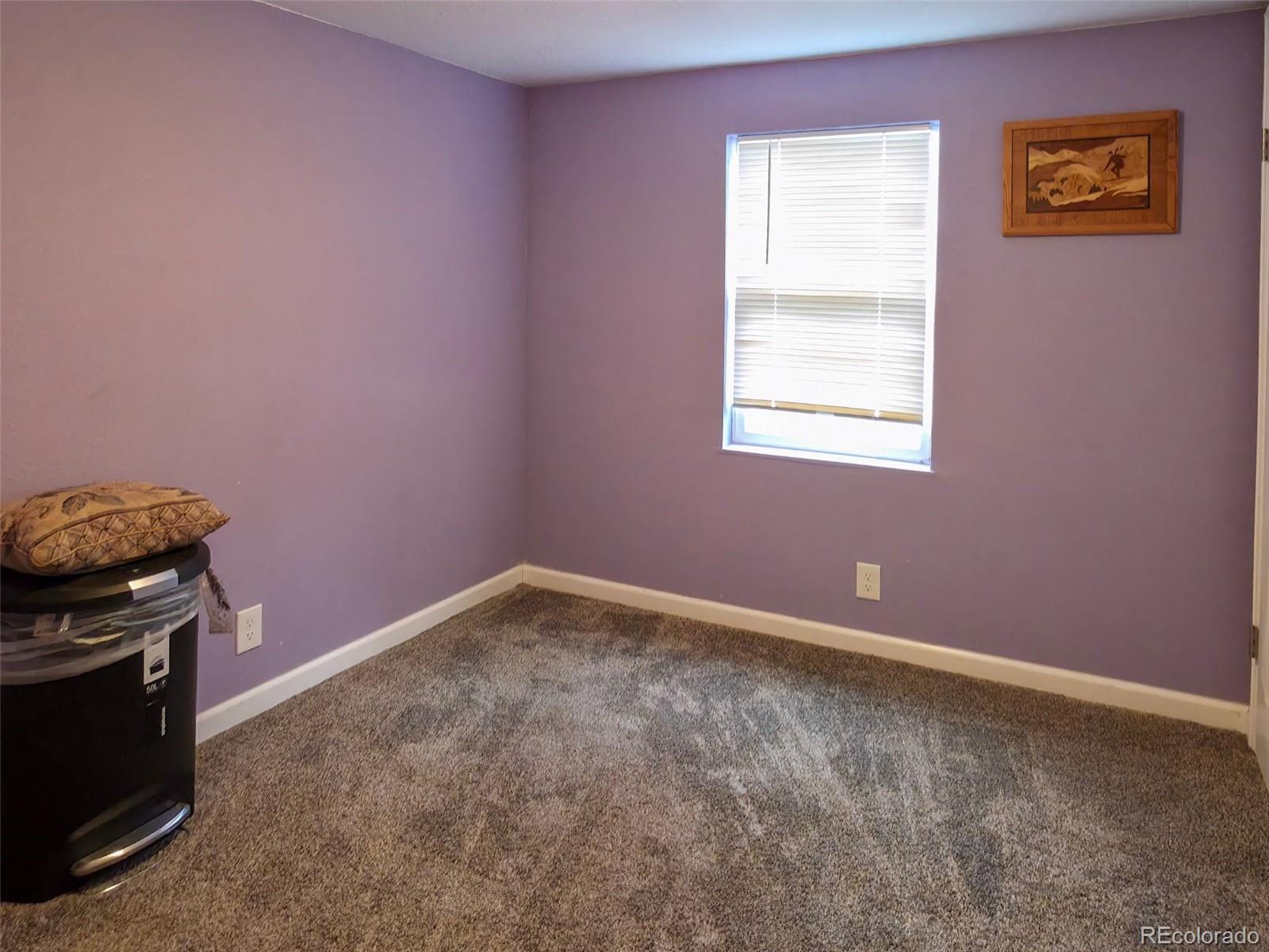 1401 9th Street Fort Lupton, CO 80621 - Photo 10 of 17 a view of a livingroom with an empty space and a window