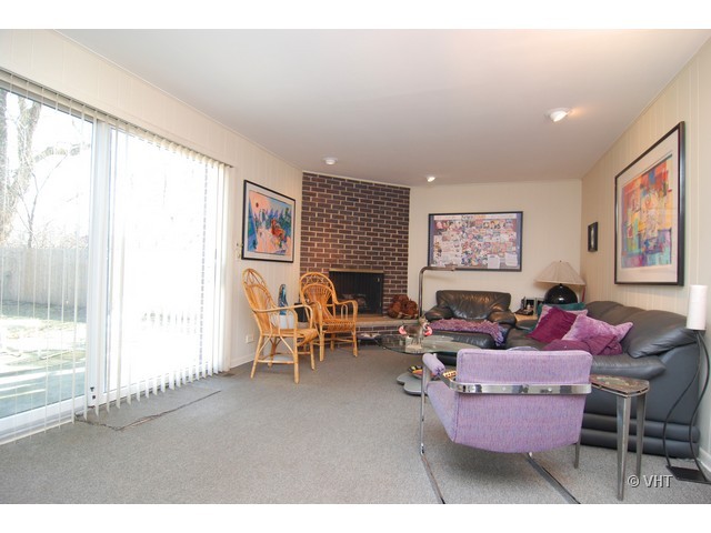 739 Sumac Road Highland Park, IL 60035 - Photo 5 of 10 a living room with furniture a window and a fireplace
