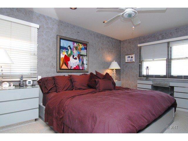739 Sumac Road Highland Park, IL 60035 - Photo 7 of 10 a bedroom with a bed and a large window