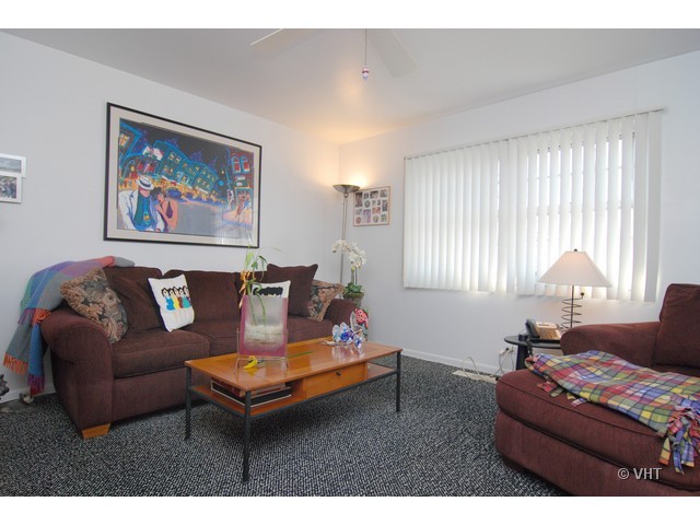 739 Sumac Road Highland Park, IL 60035 - Photo 8 of 10 a living room with furniture a bed and a large window