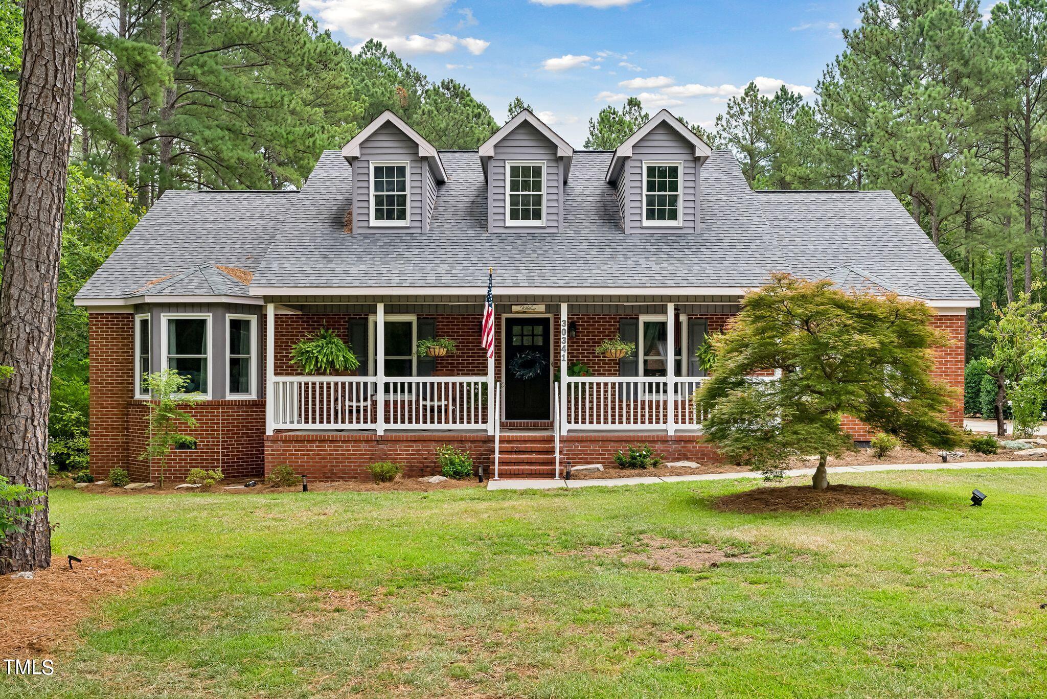 30341 East E Lake Rd Road Wagram, NC 28396 - Photo 1 of 39 front view of a house with a yard