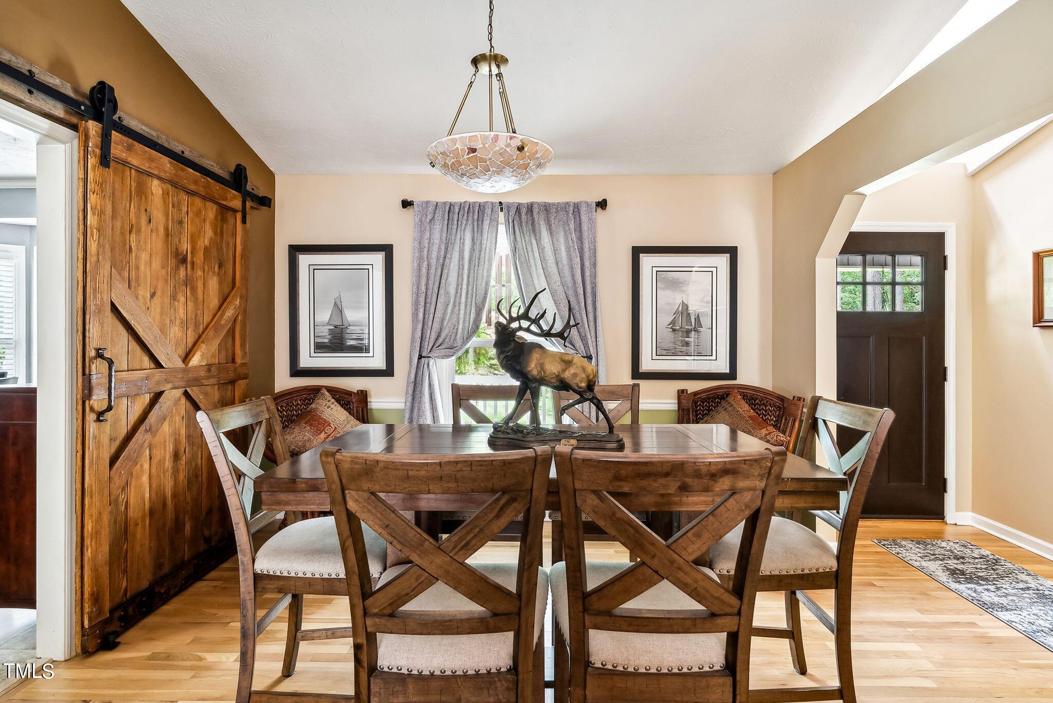 30341 East E Lake Rd Road Wagram, NC 28396 - Photo 12 of 39 a view of a dining room with furniture window and wooden floor