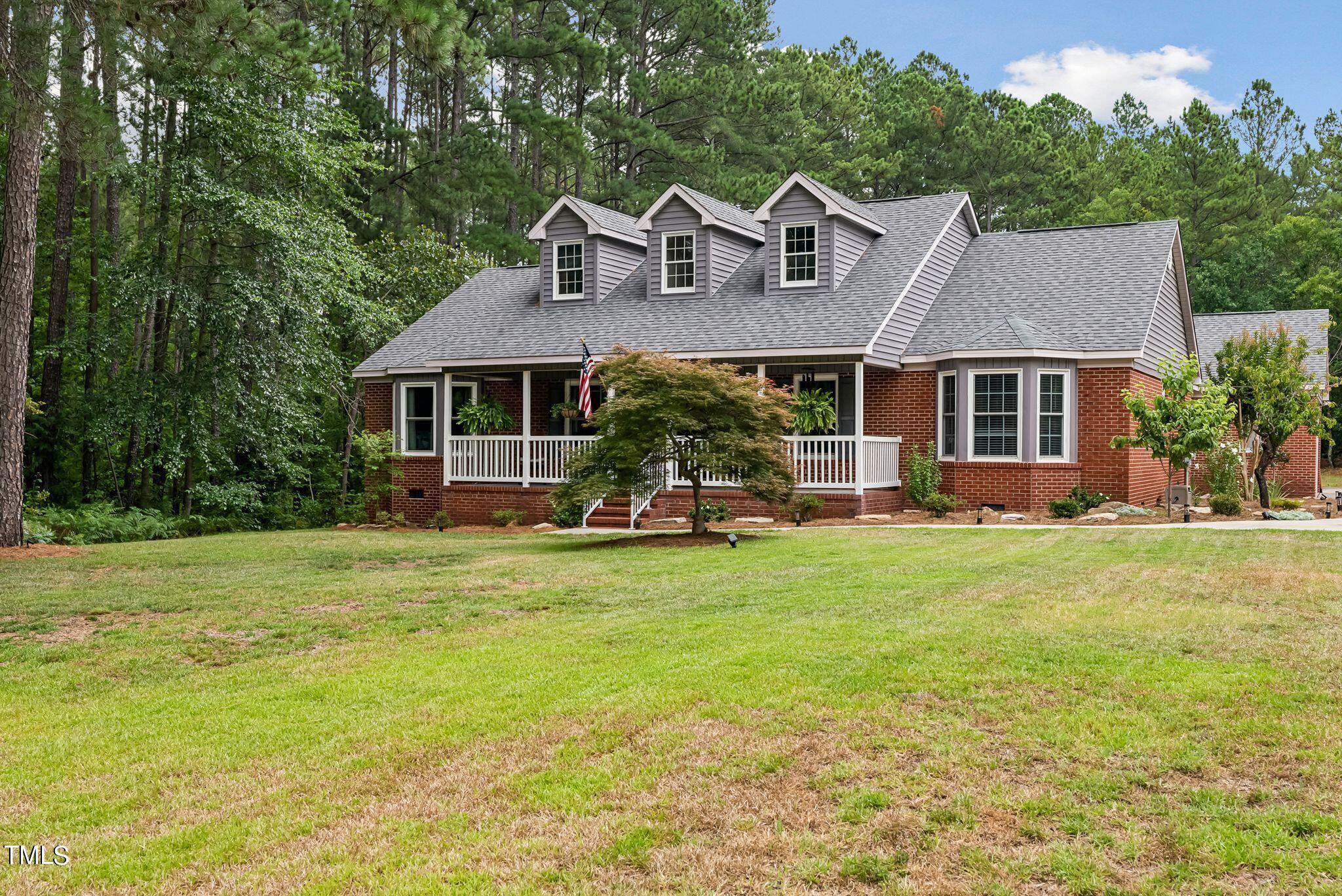 30341 East E Lake Rd Road Wagram, NC 28396 - Photo 2 of 39 front view of a house with a yard