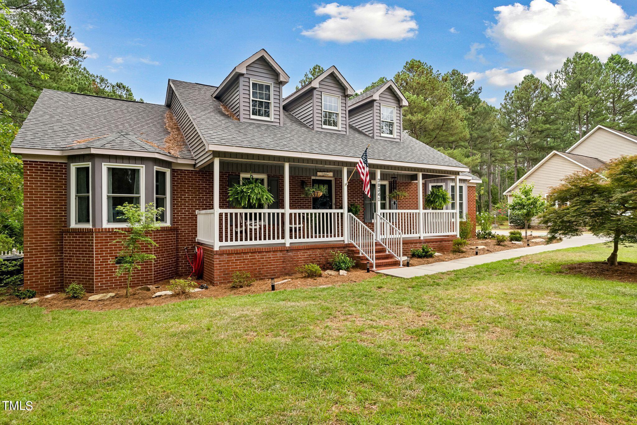 30341 East E Lake Rd Road Wagram, NC 28396 - Photo 3 of 39 a view of a house with a yard and sitting area