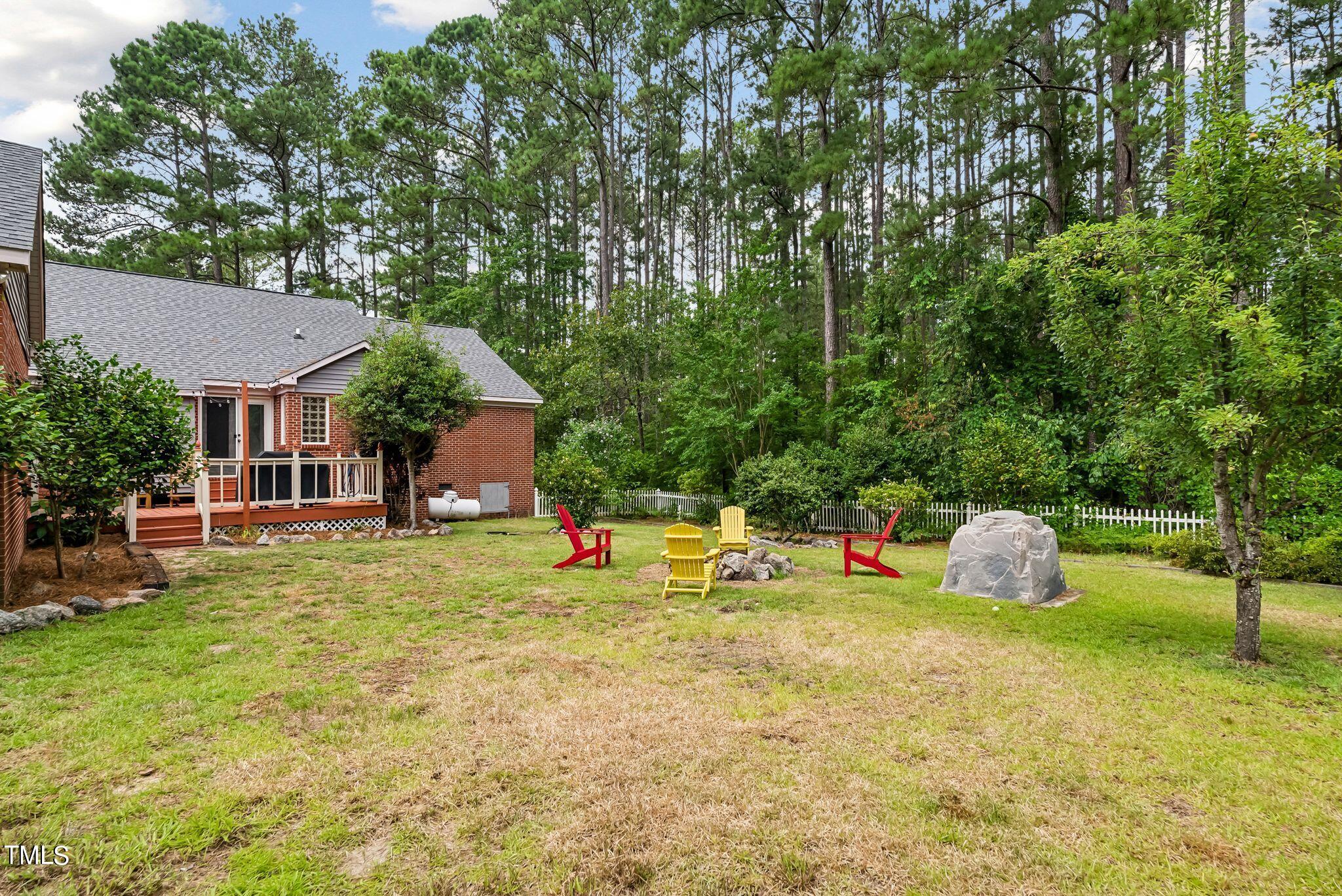 30341 East E Lake Rd Road Wagram, NC 28396 - Photo 31 of 39 a backyard of a house with table and chairs