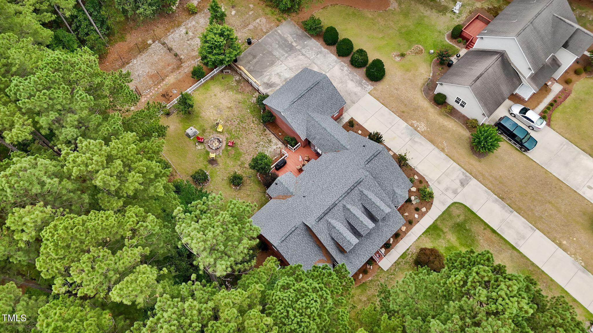 30341 East E Lake Rd Road Wagram, NC 28396 - Photo 35 of 39 an aerial view of a house with a yard and trees