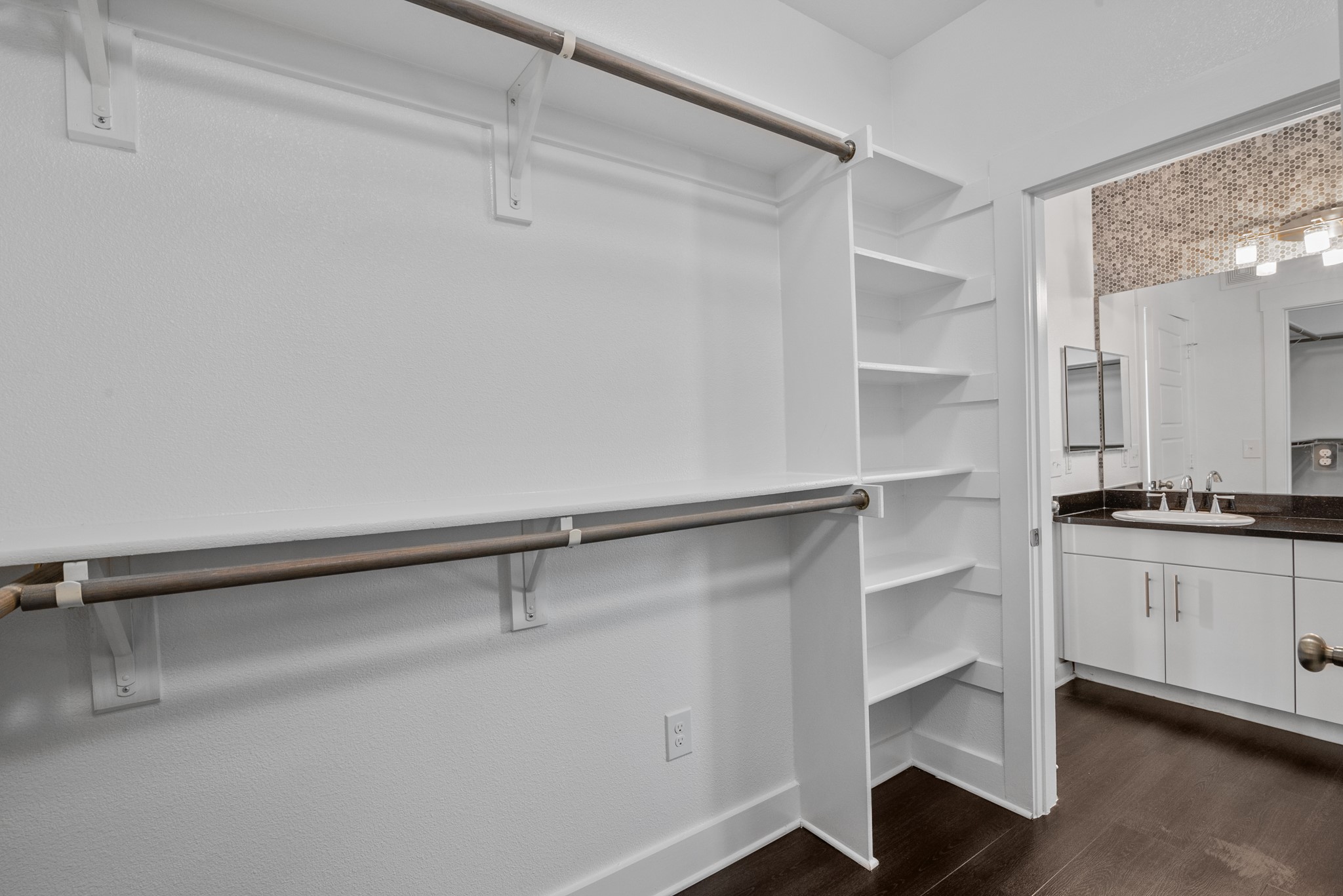 366 Fm 1488 Road, Unit 121 Conroe, TX 77384 - Photo 16 of 18 Walk in closet featuring dark wood-style flooring and a sink