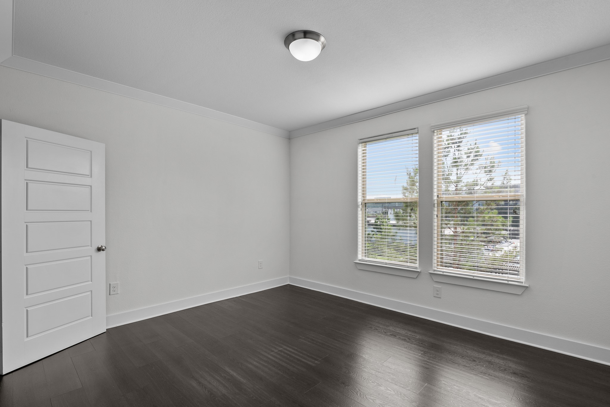 366 Fm 1488 Road, Unit 121 Conroe, TX 77384 - Photo 7 of 18 Unfurnished room with crown molding and dark wood-style flooring