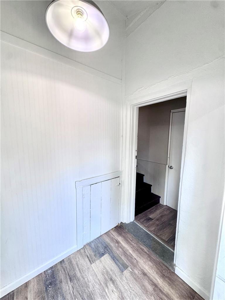 5454 Camp Meeting Road Center Valley, PA 18034 - Photo 21 of 27 Laminate flooring extends into the doorway, revealing a staircase to a lower level.