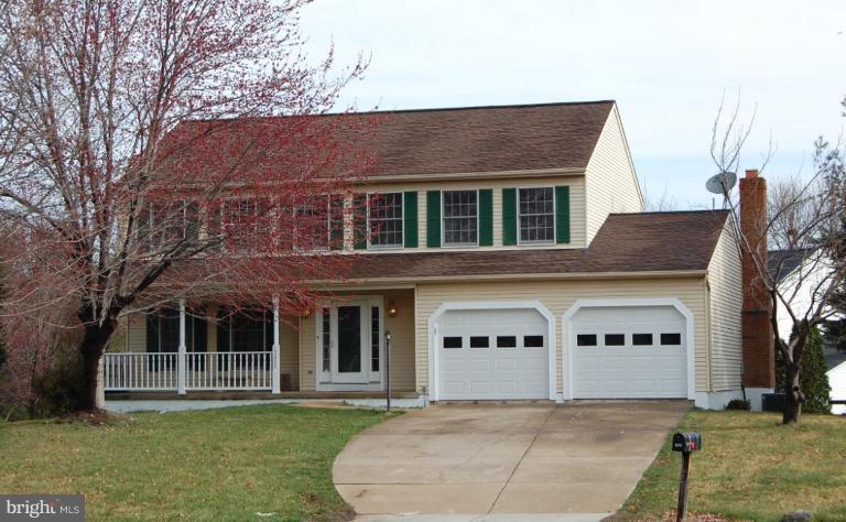 12600 Bridoon Lane Reston, VA 20191 - Photo 1 of 25 a front view of a house with a yard
