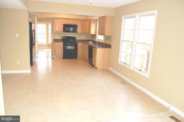 12600 Bridoon Lane Reston, VA 20191 - Photo 13 of 25 a view of a kitchen with a stove top oven