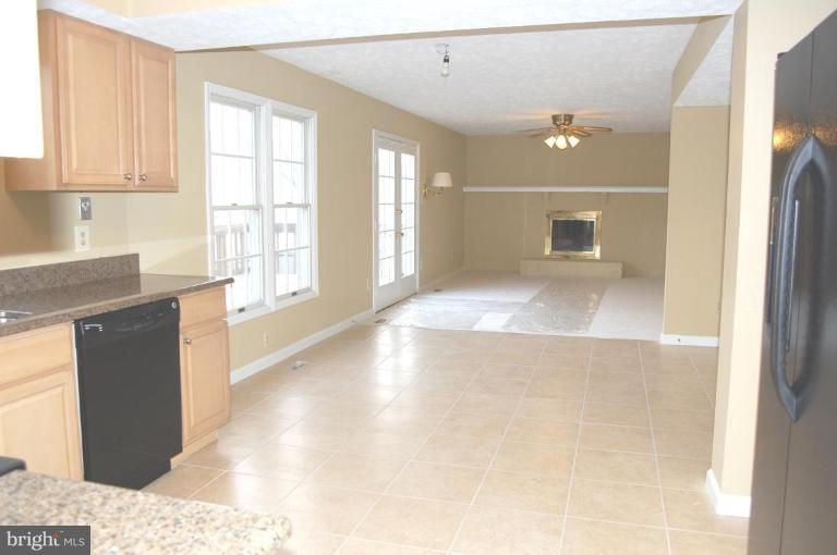 12600 Bridoon Lane Reston, VA 20191 - Photo 14 of 25 a view of a kitchen cabinets and a wooden floor