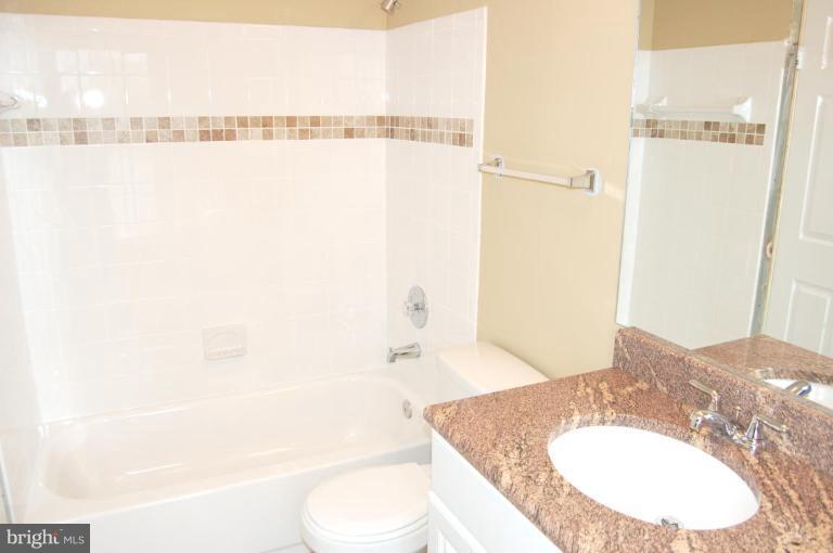 12600 Bridoon Lane Reston, VA 20191 - Photo 18 of 25 a bathroom with a sink toilet and shower