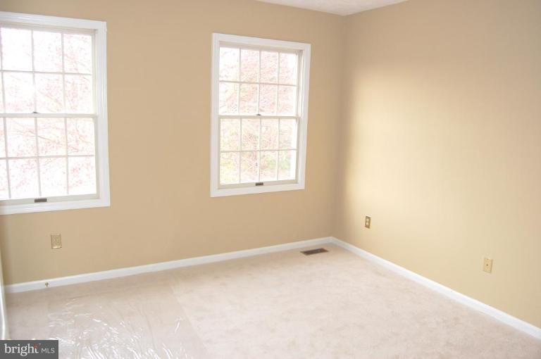 12600 Bridoon Lane Reston, VA 20191 - Photo 5 of 25 an empty room with a window