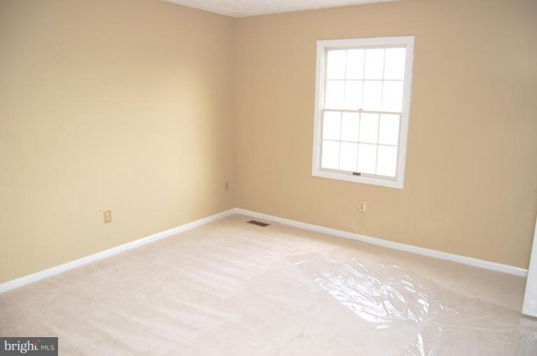 12600 Bridoon Lane Reston, VA 20191 - Photo 7 of 25 an empty room with a window