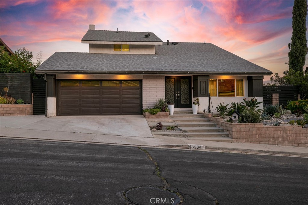 18534 Dylan Street Porter Ranch, CA 91326 - Photo 1 of 1 a front view of a house with a yard