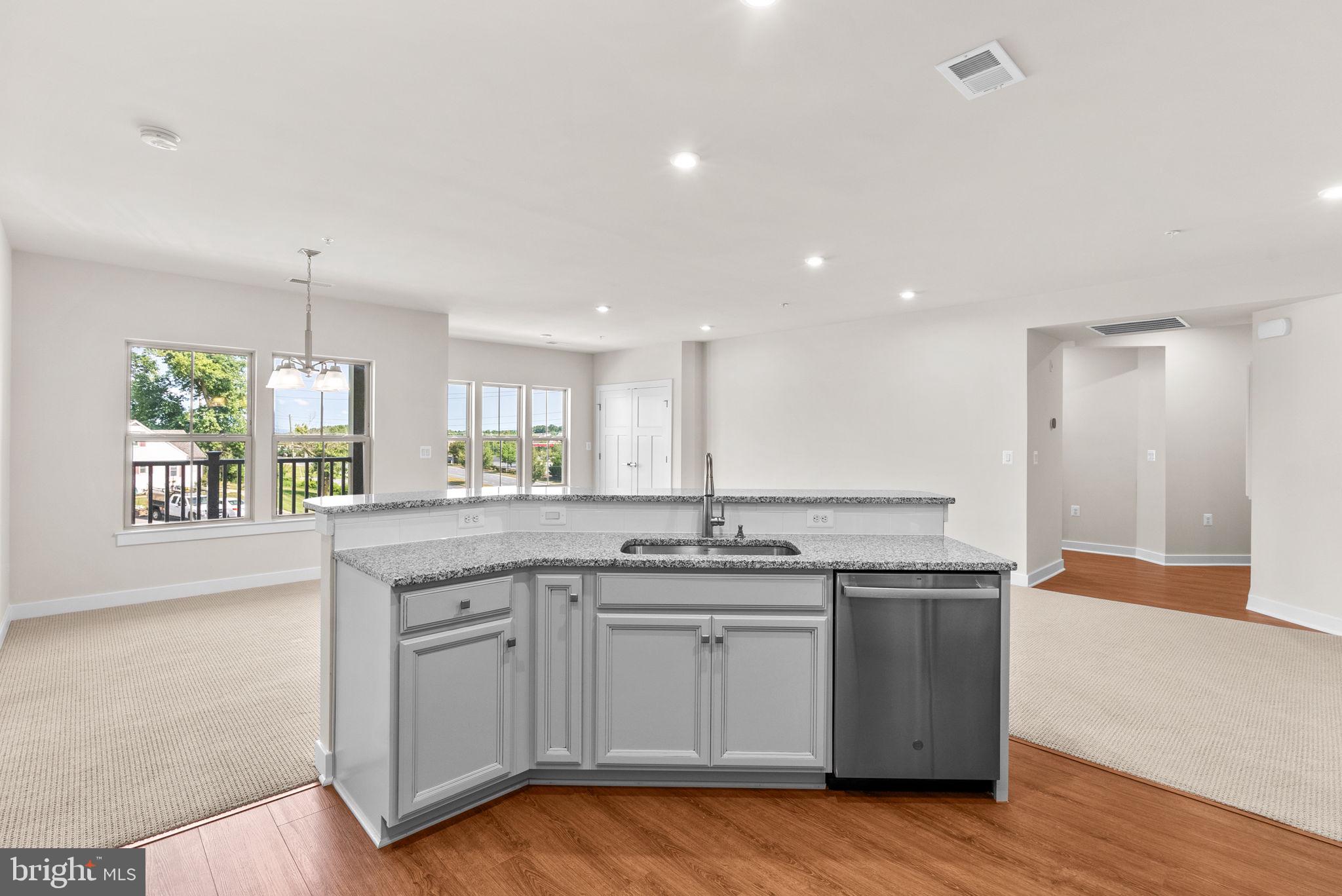 3520 Starlight Street, Unit 302 Frederick, MD 21704 - Photo 15 of 42 a kitchen with a sink cabinets and window