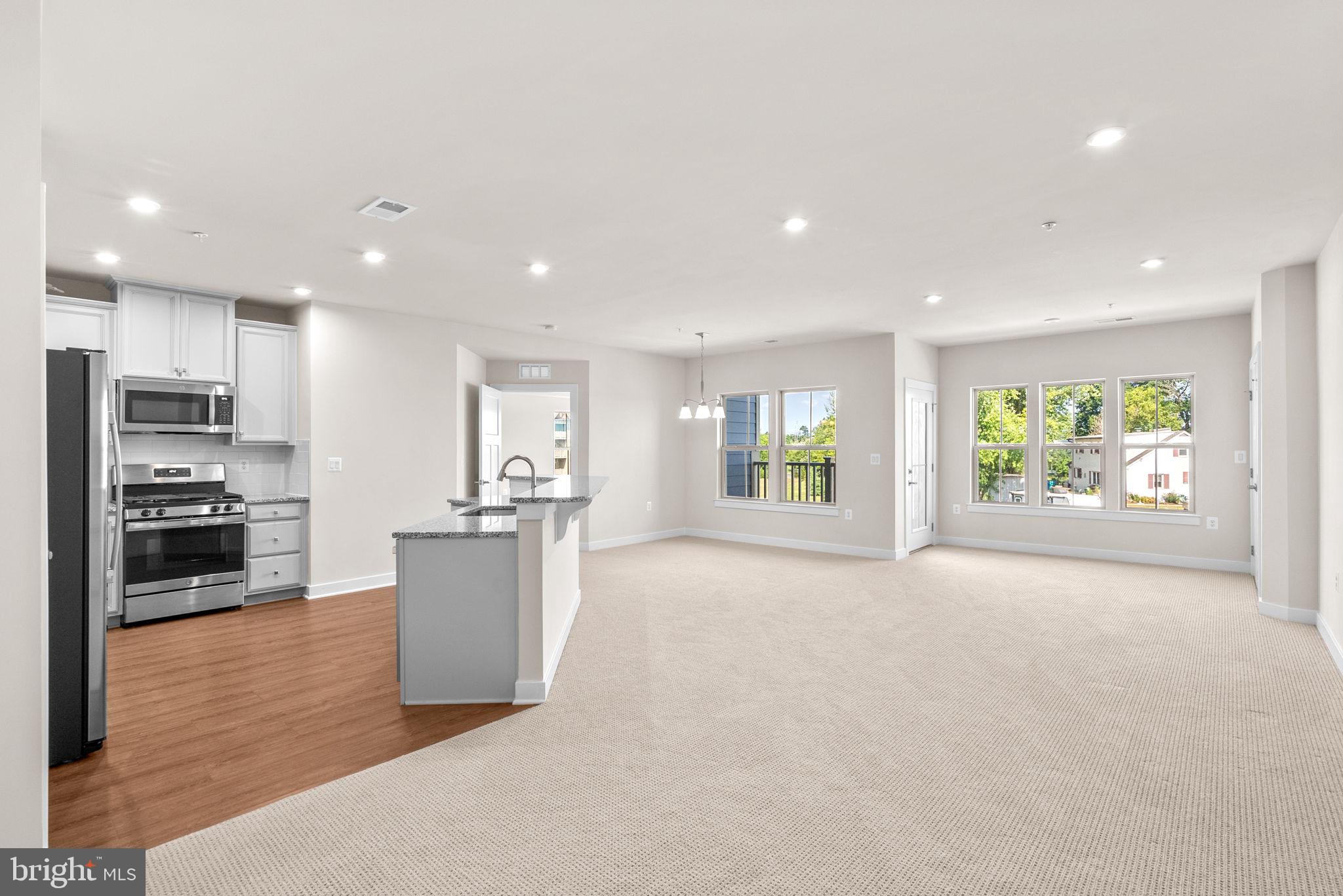 3520 Starlight Street, Unit 302 Frederick, MD 21704 - Photo 2 of 42 a view of a kitchen with a sink stove and refrigerator
