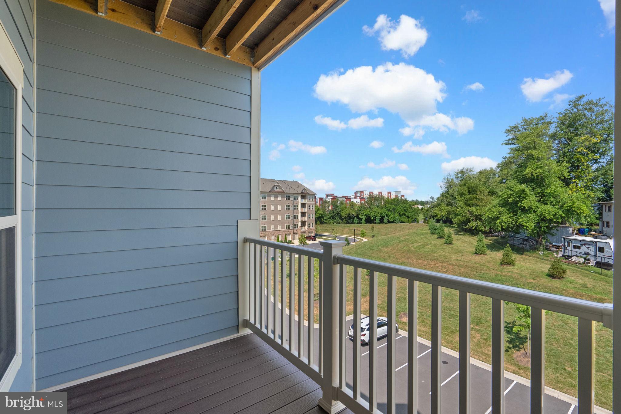 3520 Starlight Street, Unit 302 Frederick, MD 21704 - Photo 26 of 42 a view of a balcony with wooden floor
