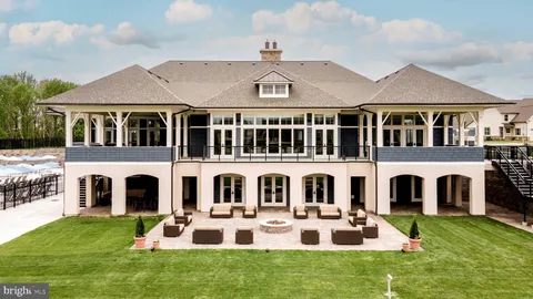 a view of a patio with couches and a fire pit