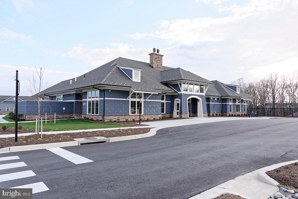 3520 Starlight Street, Unit 302 Frederick, MD 21704 - Photo 30 of 42 a front view of a house with a yard