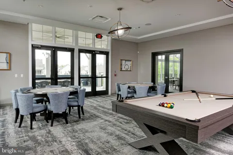 a room with pool table and a flat screen tv