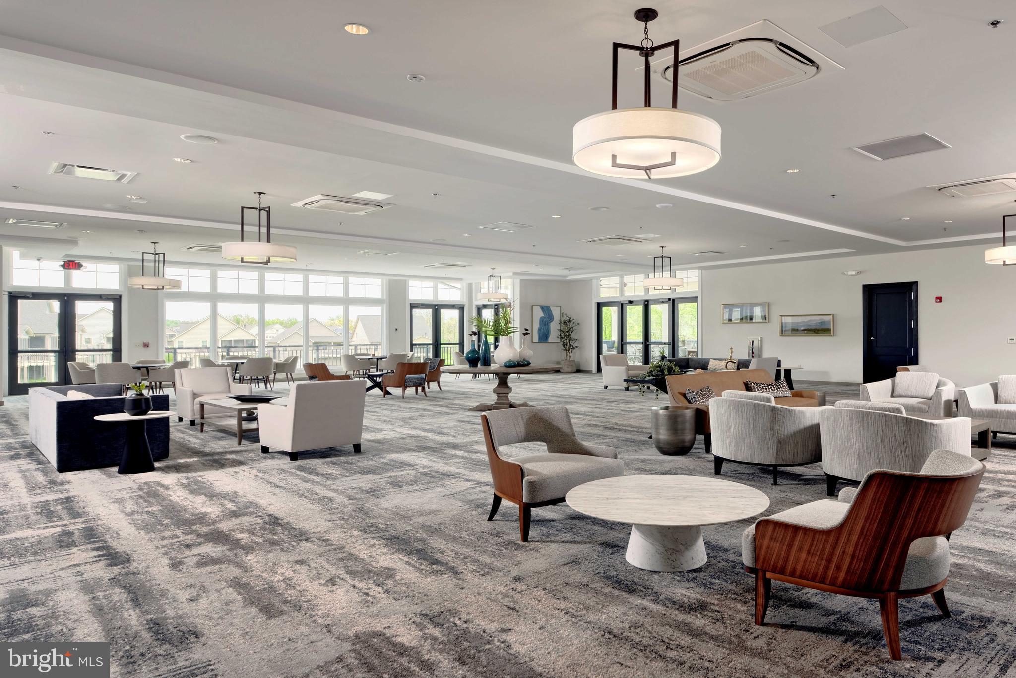 3520 Starlight Street, Unit 302 Frederick, MD 21704 - Photo 36 of 42 a living room with furniture and a chandelier