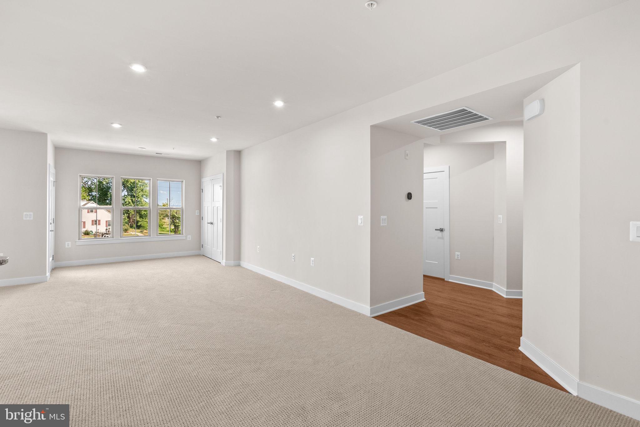 3520 Starlight Street, Unit 302 Frederick, MD 21704 - Photo 4 of 42 an empty room with windows