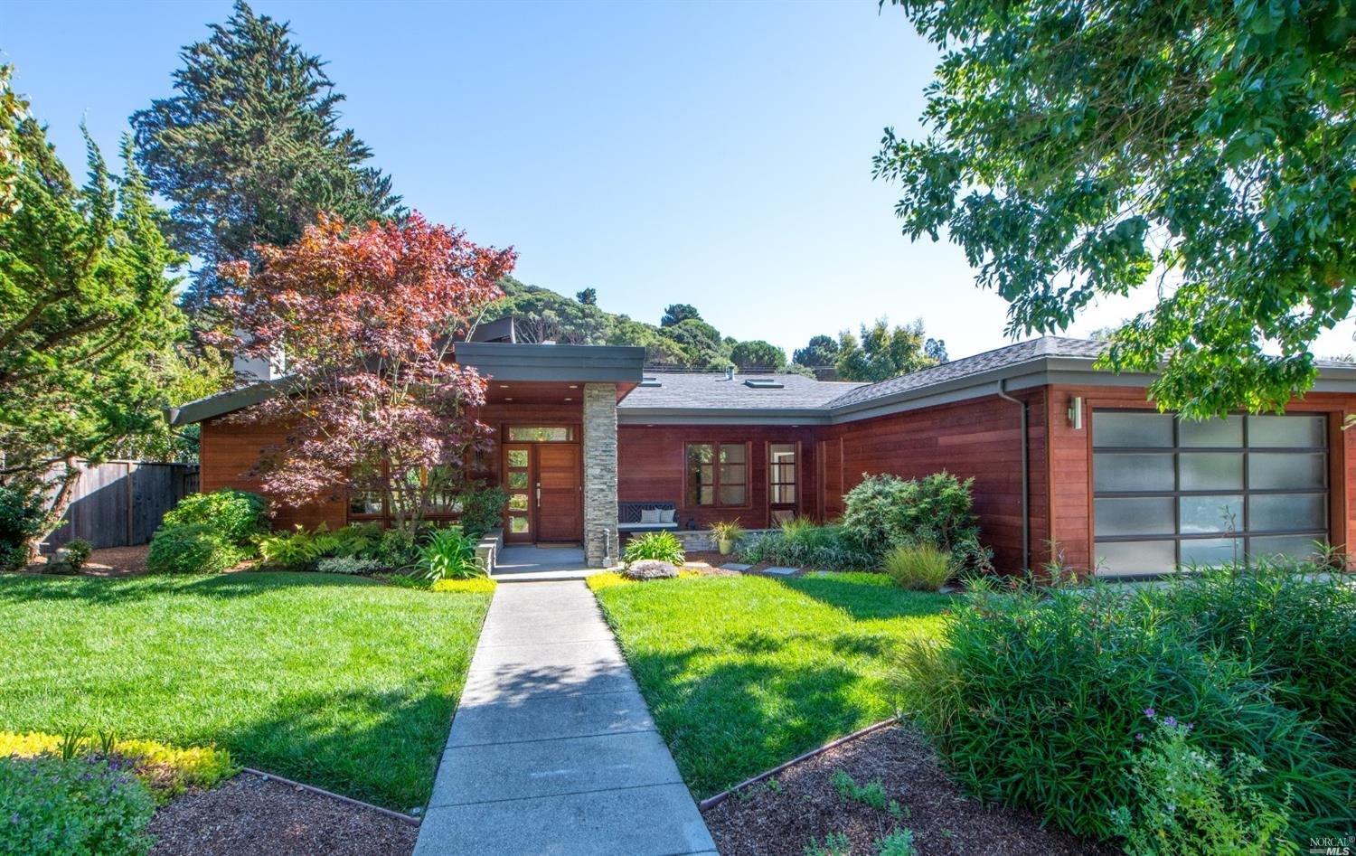 20 Juno Road Tiburon, CA 94920 - Photo 1 of 1 a front view of house with yard and green space